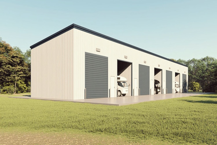 Portal frame steel structure showing primary I-beams and secondary purlins for industrial storage