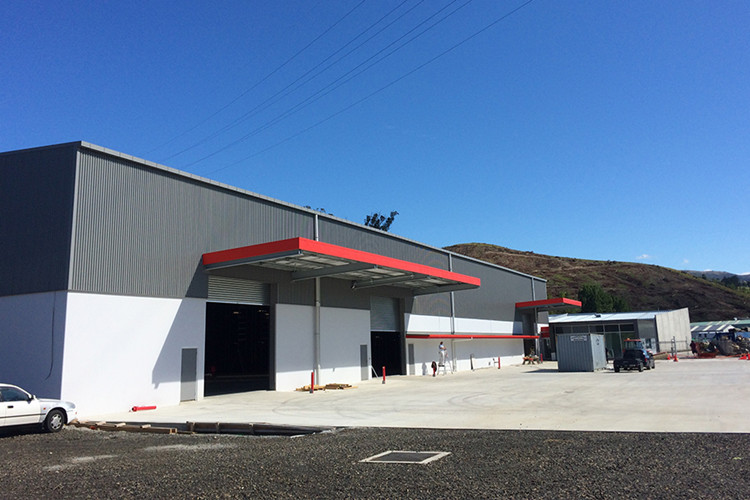 Exterior view of completed logistics warehouse with steel sandwich panel insulation