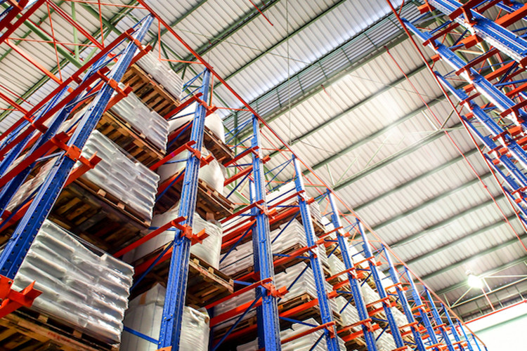 High-density logistics warehouse interior showing vertical pallet racking systems